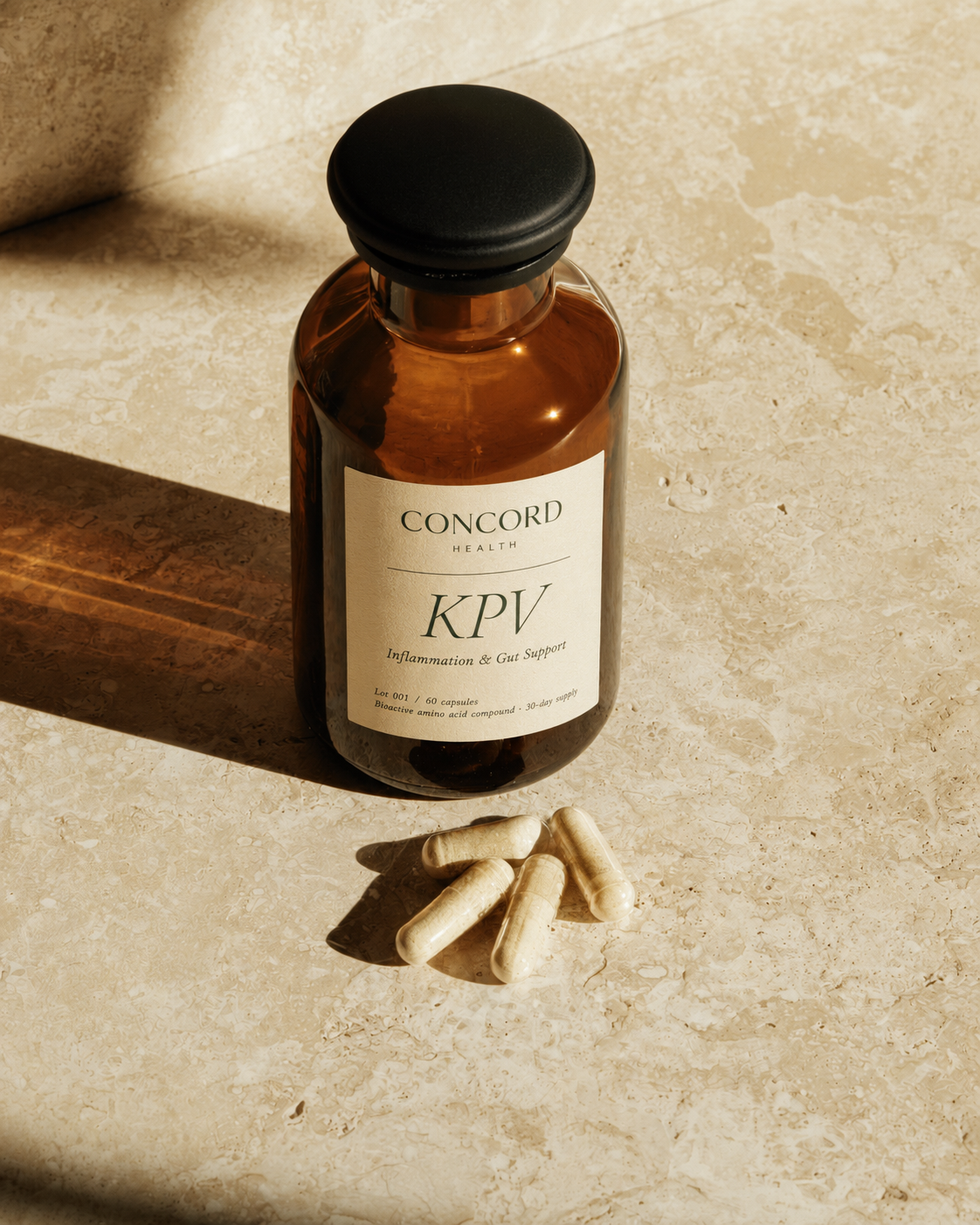 Concord Health KPV — the amber bottle with cream capsules spilled onto a warm bone stone surface in morning light.