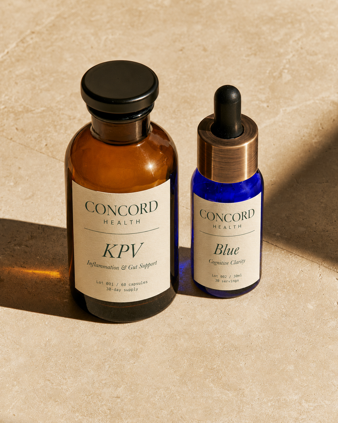 KPV and Blue, the two Concord Health formulations, photographed side by side on a warm bone stone surface.